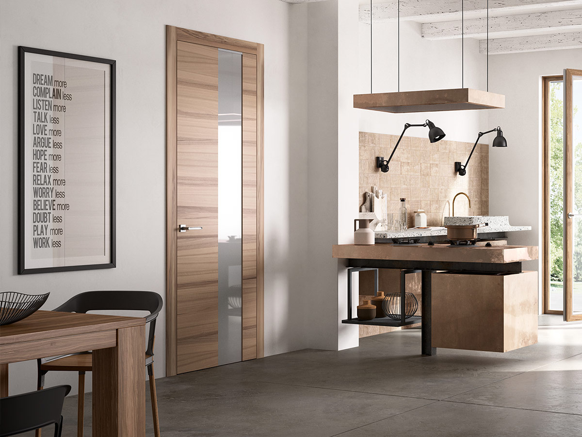 puerta en roble natural con vidrio colocada en ua cocina moderna